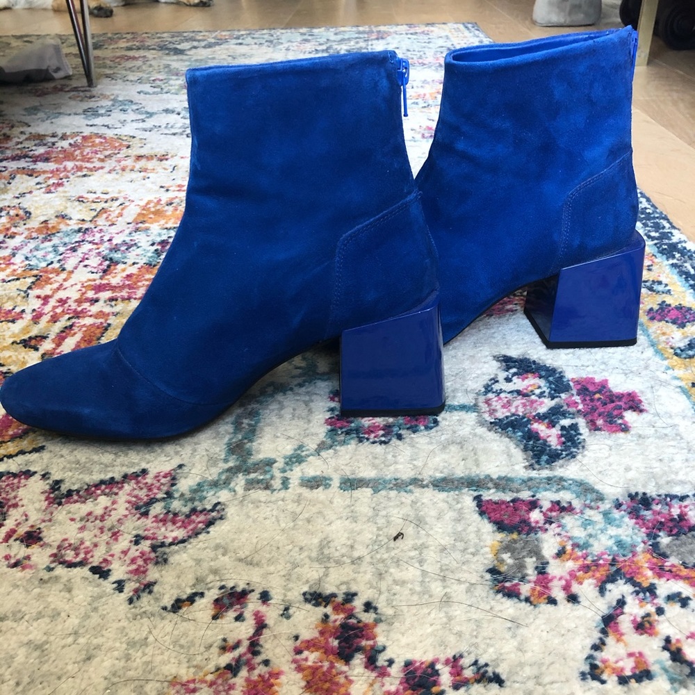 Cobalt blue suede boots with a square block heel.
